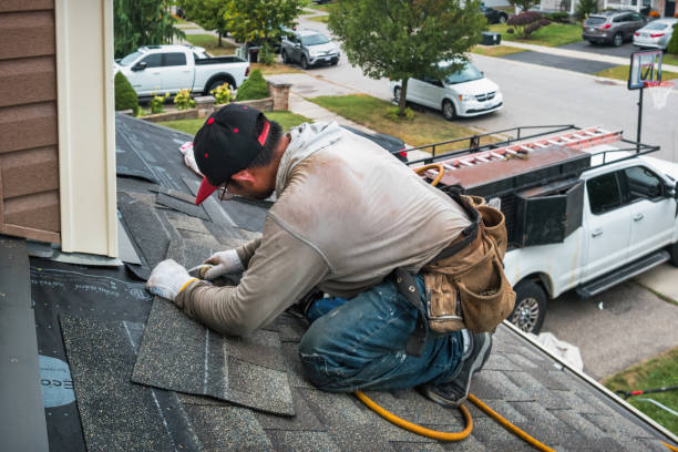 Professional Roofing technician working in Hewlett, NY